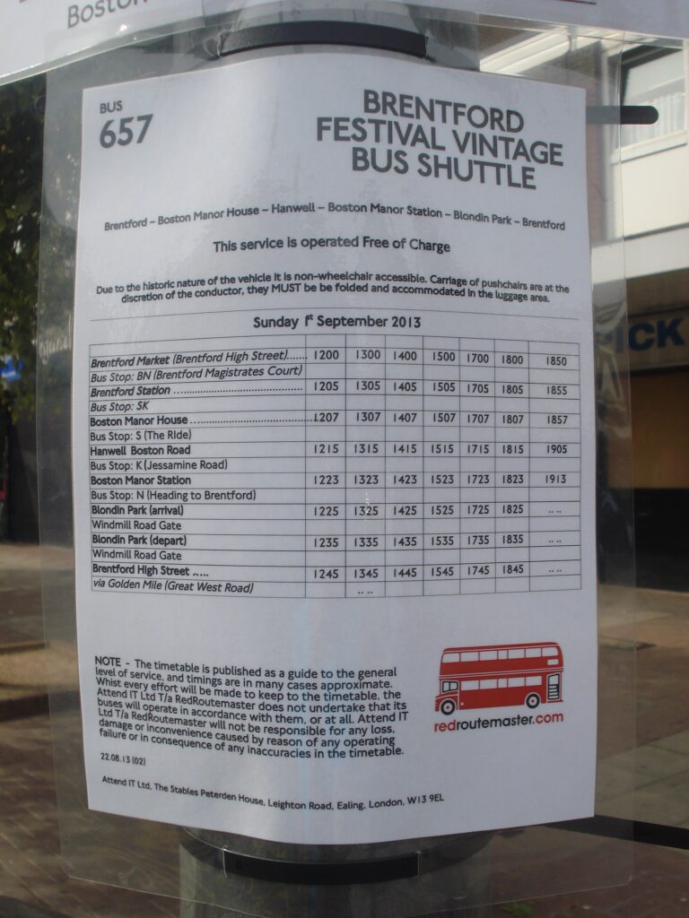 Shuttle bus dropping passengers at a festival entrance gate