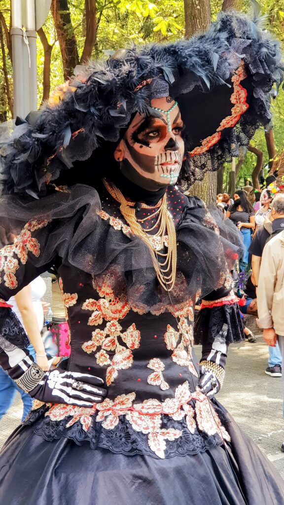 La Catrina figure and calavera face painting during Day of the Dead celebrations