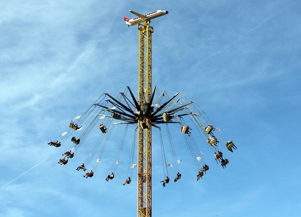 A fairground carousel lit up at Oktoberfest in Munich