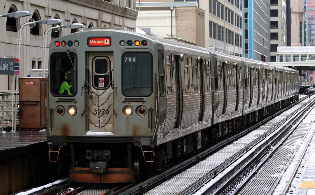 An elevated Chicago 'L' train passing through the downtown Loop
