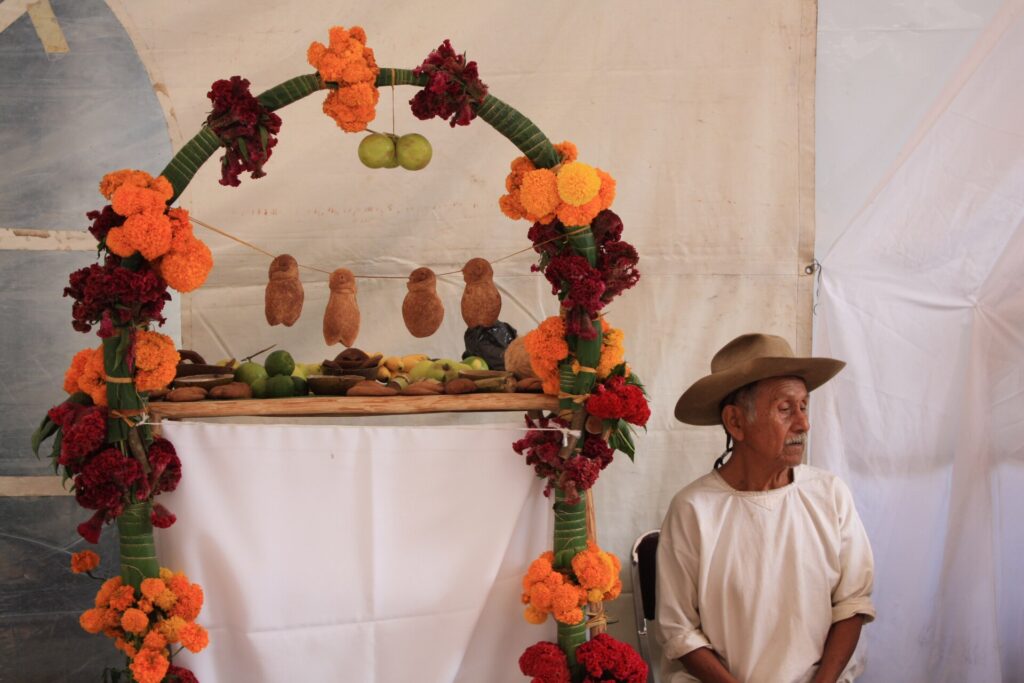 Cempasúchil marigolds and candles on a Day of the Dead altar in Oaxaca