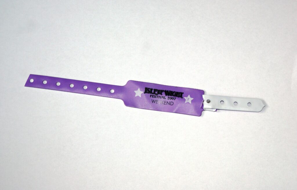 Festival wristbands on a wrist at the gate