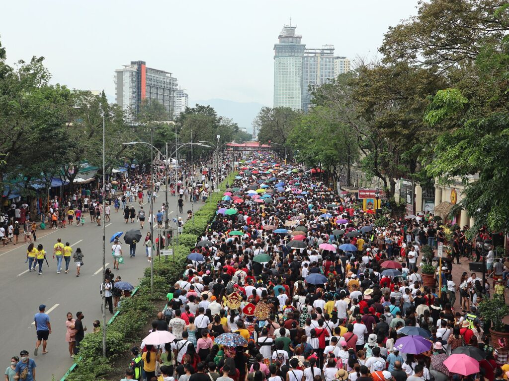 Devotees carrying the Santo Niño image in a Sinulog procession through Cebu City