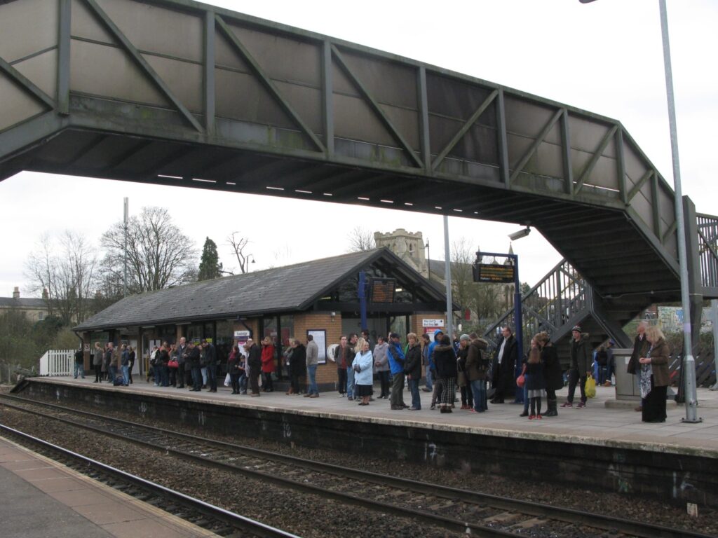 Crowds leaving a festival on a train station platform at night
