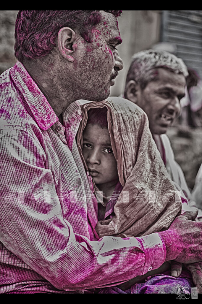 Hands and clothes covered in coloured gulal powder after Holi