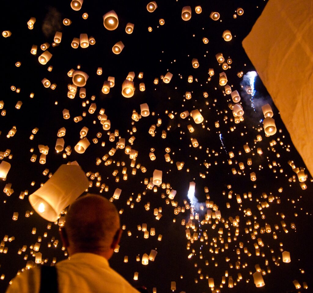 Sky lanterns rising at the Yi Peng festival in San Sai, Thailand